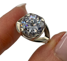 Load image into Gallery viewer, Vintage 925 sterling silver statement ring with cubic zirconia, women's size 6, featuring intricate design and sparkling stones.