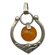 Load image into Gallery viewer, Vintage USSR 875 silver Baltic amber Art Nouveau pendant with intricate design, showcasing a striking amber stone in a detailed silver setting.