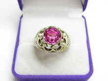 Load image into Gallery viewer, Front view of a vintage 875 silver round amethyst ring with a decorative openwork frame in a purple jewelry box.