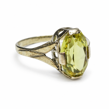 Load image into Gallery viewer, Side view of vintage Soviet 875 silver citrine ring with raised oval gemstone, four-prong setting, and symmetrical triangular openwork shoulders.