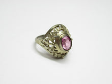 Load image into Gallery viewer, Vintage 875 silver gilt amethyst ring on a white surface, showing the slim band and decorative floral openwork shoulders.