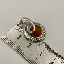 Load image into Gallery viewer, Vintage sterling silver amber swirl pendant showcasing modern statement jewelry with intricate design and polished finish.