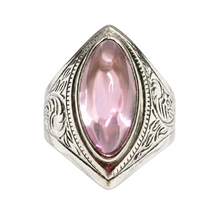 Load image into Gallery viewer, Vintage 875 silver statement ring with a pink amethyst cabochon, pointed oval frame and engraved scroll details on white.