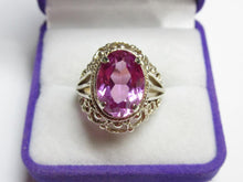 Load image into Gallery viewer, Front view of a vintage 875 silver gilt amethyst ring with a scalloped filigree frame in a purple jewelry box.