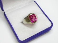 Load image into Gallery viewer, Angled view of an 875 silver gilt amethyst ring showing the rectangular faceted stone and broad tapered shoulders.