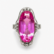 Load image into Gallery viewer, Vintage 875 silver ring with an elongated oval pink amethyst and polished bead accents around an open frame on white.