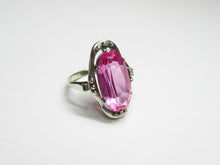 Load image into Gallery viewer, Vintage 875 silver amethyst ring on a white surface, showing the raised oval stone, open frame and beaded details.