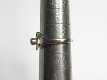 Load image into Gallery viewer, Side view of an 875 silver gilt amethyst ring on a ring sizing mandrel, showing the band and prong setting.
