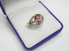 Load image into Gallery viewer, Angled view of an 875 silver gilt amethyst ring in a jewelry box, showing the faceted oval stone and swirl design.
