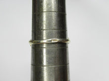 Load image into Gallery viewer, Close-up of stamped hallmarks on the slim gilt band of a vintage amethyst swirl ring resting on a sizing mandrel.