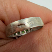 Load image into Gallery viewer, Vintage 925 sterling silver eternity ring with green peridot gemstones, size 9.5, featuring a detailed band design.