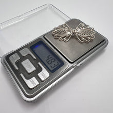 Load image into Gallery viewer, Vintage silver filigree butterfly brooch with intricate wirework, handmade jewelry pin featuring delicate craftsmanship.
