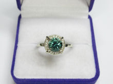 Load image into Gallery viewer, Close-up of Round Faceted Green Tourmaline with Cubic Zirconia Halo on Vintage 925 Silver Ring
