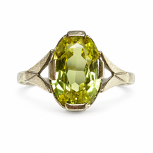 Load image into Gallery viewer, Vintage USSR 875 silver citrine ring featuring a large oval faceted yellow-green gemstone, geometric split shoulders, and Art Deco-inspired openwork, US size 7.75.
