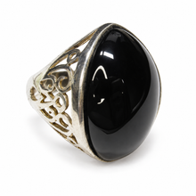 Load image into Gallery viewer, Side view of vintage 925 sterling silver black agate ring with a raised oval cabochon, intricate Art Nouveau-inspired scrollwork, and decorative openwork shoulders.

