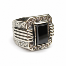 Load image into Gallery viewer, Side view of vintage sterling silver 925 black agate and CZ ring with rectangular gemstone, Art Deco-inspired horizontal ribbed shoulders, textured silver panels, and geometric design.
