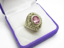 Load image into Gallery viewer, Angled view of an 875 silver gilt amethyst ring showing the faceted oval stone, broad bezel and openwork leaf details.
