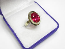 Load image into Gallery viewer, Close-up of Deep Pink-Red Oval Faceted Tourmaline on Vintage 875 Silver Gilded Ring
