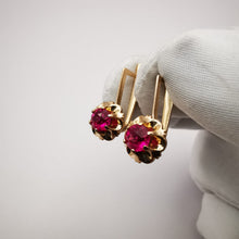 Load image into Gallery viewer, Side View of Vintage 583 Rose Gold Earrings with Round Ruby Stones
