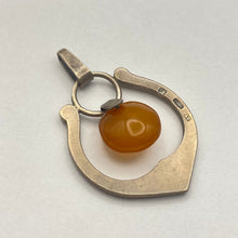 Load image into Gallery viewer, Vintage USSR silver Baltic amber pendant featuring Art Nouveau design, showcasing a detailed amber centerpiece on a silver setting.
