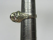 Load image into Gallery viewer, Side view of an 875 silver amethyst ring on a sizing mandrel, showing the engraved leaf shoulder and raised openwork setting.
