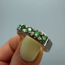 Load image into Gallery viewer, Sterling silver eternity ring with green peridot gemstones, size 9.5, showcasing a vintage style band with vibrant green accents.
