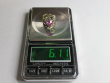 Load image into Gallery viewer, Vintage 875 silver pink amethyst ring worn on a finger, showing the elongated oval gemstone and silver bead accents.
