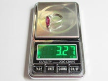Load image into Gallery viewer, A silver ring with a round pink gemstone is shown on a digital scale displaying a weight of 3.27 grams.
