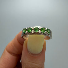 Load image into Gallery viewer, Vintage 925 Sterling Silver Peridot eternity ring with green gemstones, size 9.5, featuring a polished band and detailed craftsmanship.
