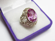 Load image into Gallery viewer, Angled view of an 875 silver gilt amethyst ring showing the oval faceted stone, four prongs and filigree surround.
