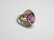 Load image into Gallery viewer, Vintage 875 silver gilt amethyst ring on a white surface, showing split shoulders, rope details and open scrollwork.
