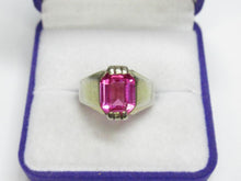 Load image into Gallery viewer, Front view of a vintage 875 silver gilt emerald-cut amethyst ring in a purple and white jewelry box.
