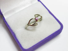 Load image into Gallery viewer, Angled view of an 875 silver gilt amethyst ring showing open swirl shoulders and textured triangular details.
