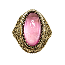 Load image into Gallery viewer, Vintage 875 silver gilt ring with an oval pink amethyst cabochon, ornate filigree shoulders and beaded border on white.
