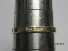 Load image into Gallery viewer, Close-up of the 875 silver hallmark and maker's mark stamped on the gilt band of an amethyst cabochon ring.
