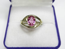 Load image into Gallery viewer, Front view of a vintage 875 silver gilt oval amethyst ring with curved openwork shoulders in a purple jewelry box.
