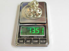 Load image into Gallery viewer, Three silver-toned filigree rings displayed on a digital pocket scale showing a weight of 13.51 grams.
