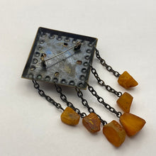 Load image into Gallery viewer, Vintage USSR Baltic Amber dangle brooch by Fezba Market featuring brutalist silver design and natural amber stones.
