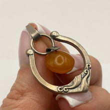 Load image into Gallery viewer, Vintage USSR 875 silver Baltic amber Art Nouveau pendant showcasing intricate design and warm amber gemstone.
